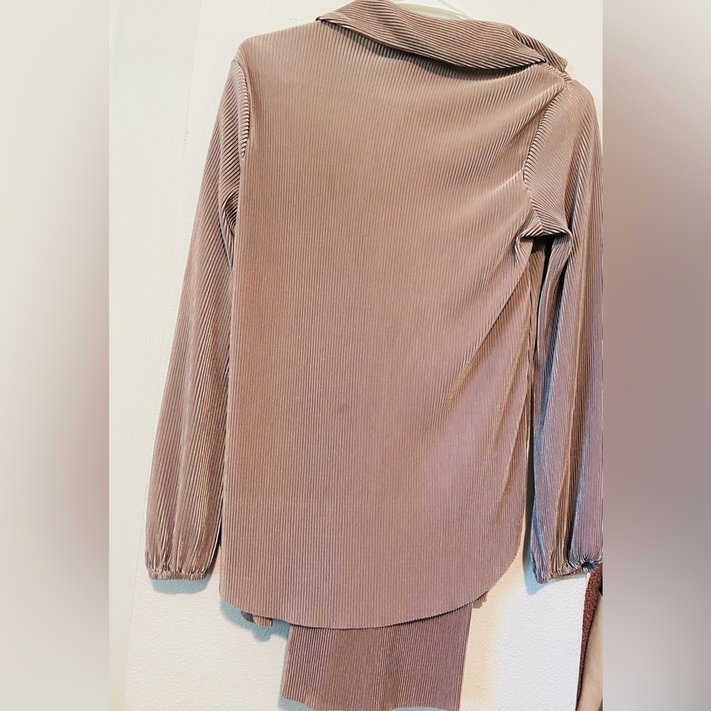 A downright glamorous pleated button-down set